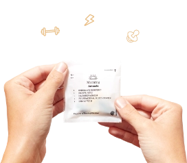 hand holding a vitamin pack