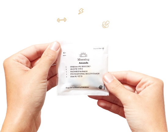 hand holding a vitamin pack